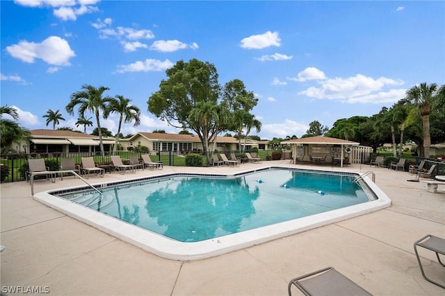 view of swimming pool with a patio area