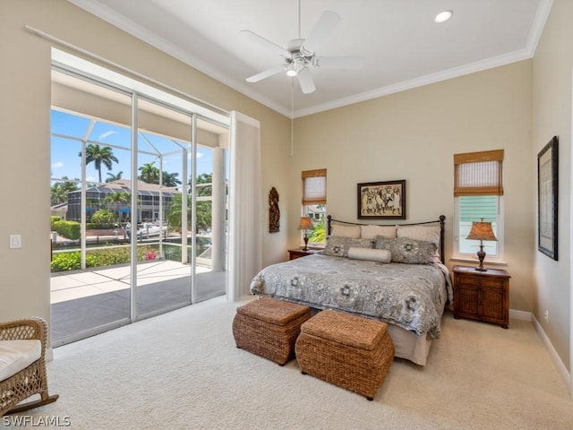 carpeted bedroom with access to outside, ceiling fan, and ornamental molding