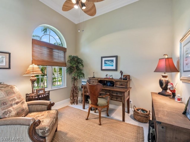 office with high vaulted ceiling, ceiling fan, ornamental molding, and light tile patterned flooring