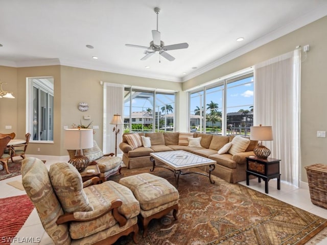 tiled living room with ceiling fan and crown molding