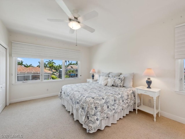 bedroom featuring carpet, a closet, and ceiling fan