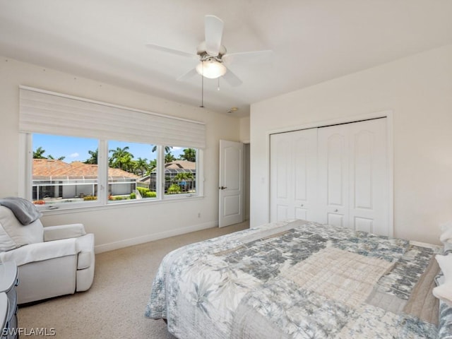 bedroom featuring a closet, ceiling fan, and light colored carpet