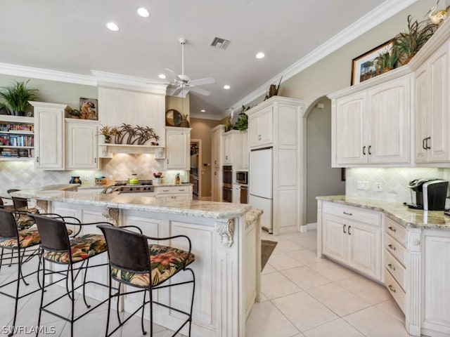 kitchen featuring white cabinetry, white fridge, and ceiling fan