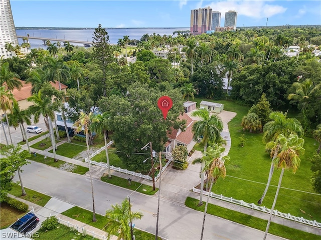 birds eye view of property with a water view