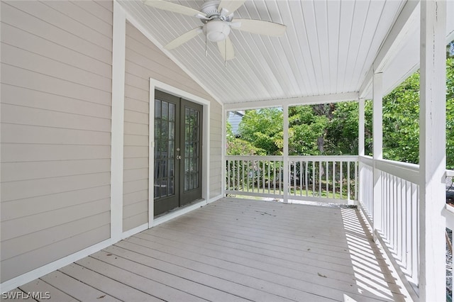 deck with french doors and ceiling fan