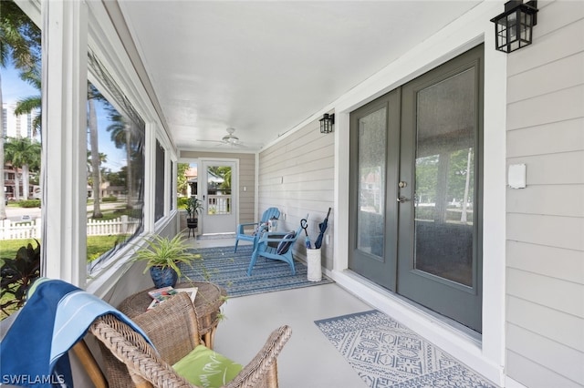 sunroom with french doors and ceiling fan