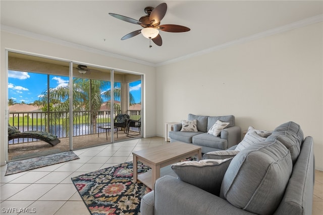 tiled living room featuring ceiling fan, a water view, and crown molding