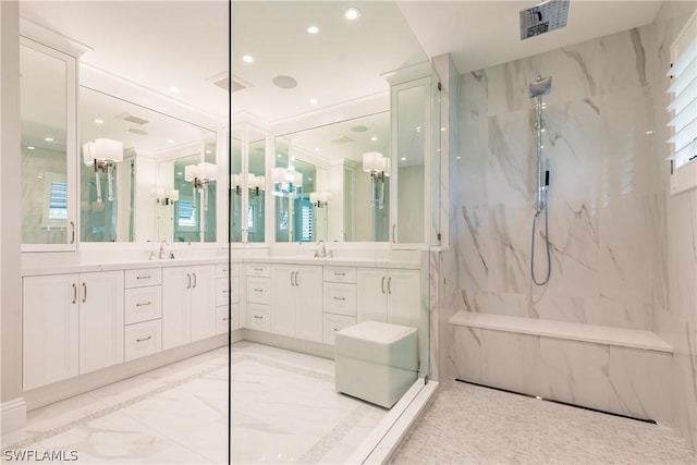 bathroom with marble finish floor, visible vents, a sink, and a marble finish shower