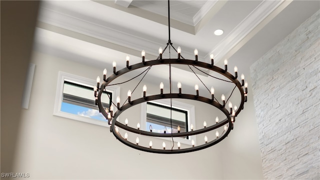 room details with ornamental molding and a chandelier