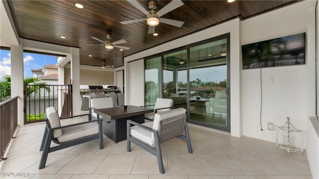 sunroom featuring wood ceiling