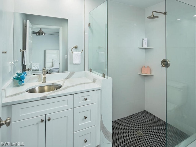 bathroom featuring vanity and tiled shower