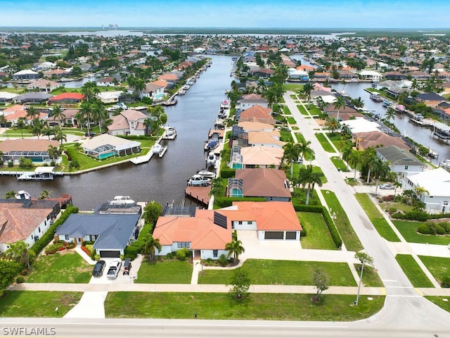 bird's eye view with a residential view and a water view