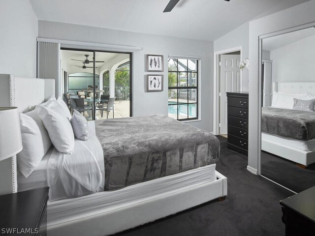 carpeted bedroom featuring ceiling fan and lofted ceiling