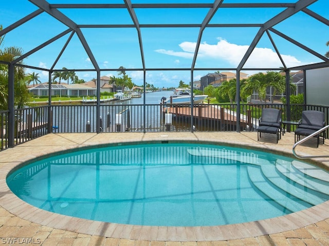 view of swimming pool with a patio area, a dock, a water view, and glass enclosure