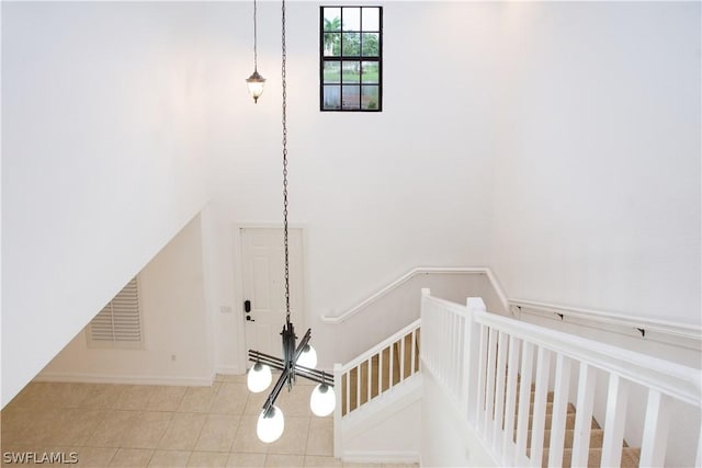 stairs with tile patterned flooring