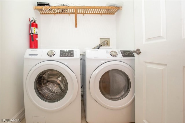 washroom with separate washer and dryer