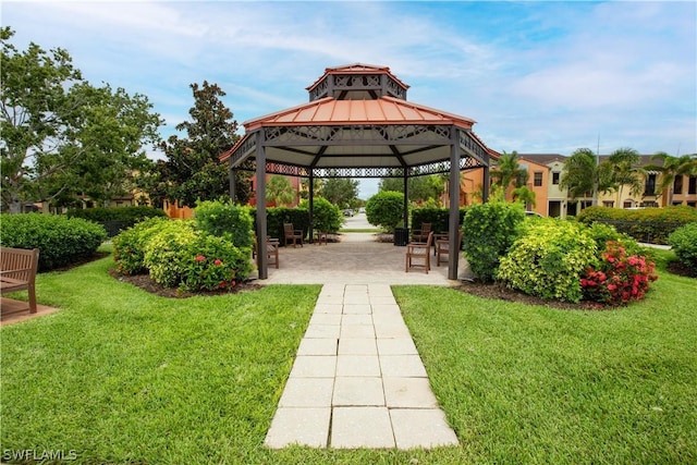 surrounding community with a gazebo and a lawn