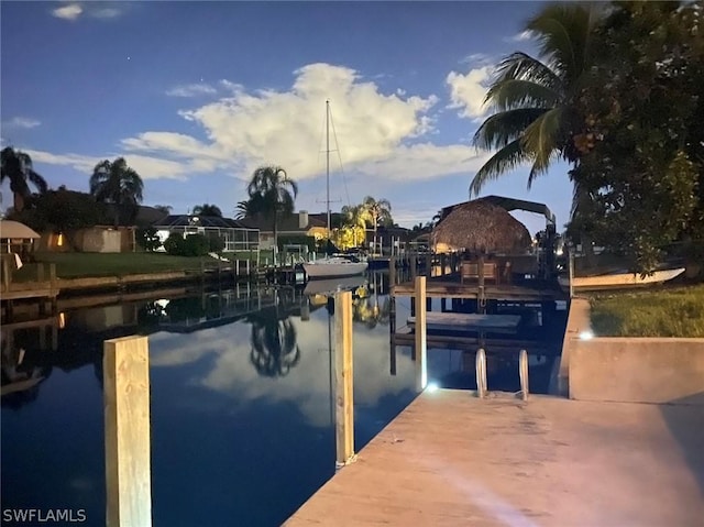 view of dock with a water view and boat lift