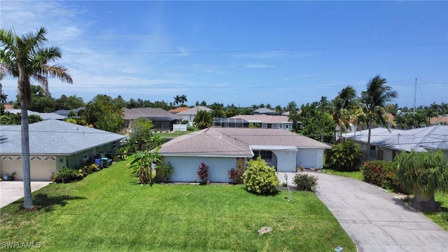 single story home with a garage and a front lawn