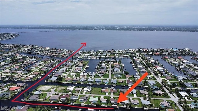 aerial view featuring a residential view and a water view