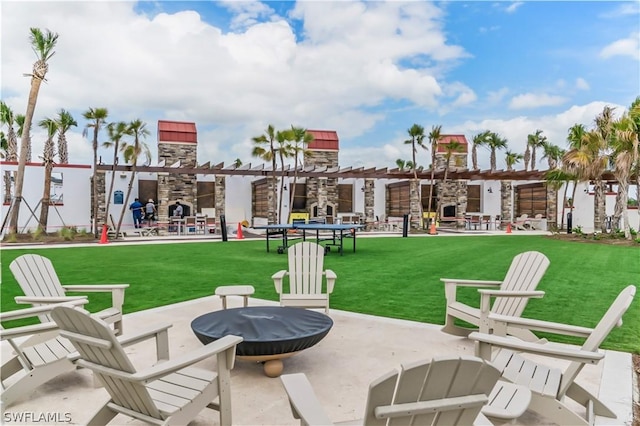 view of patio with an outdoor stone fireplace