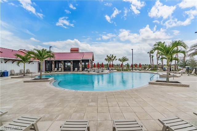 view of swimming pool featuring a patio