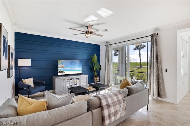 tiled living room with ceiling fan and ornamental molding