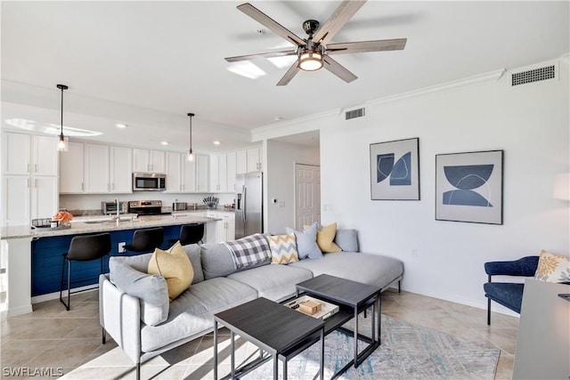 43030 Greenway Blvd Unit 412, Punta Gorda, FL 33982 - living area with crown molding, recessed lighting, a ceiling fan, baseboards, and light tile patterned floors