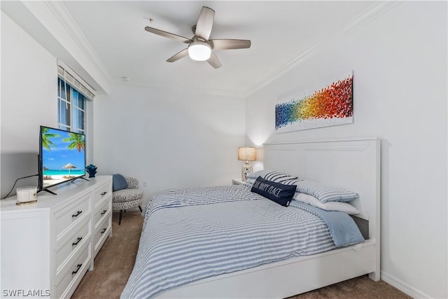 carpeted bedroom with ceiling fan and crown molding