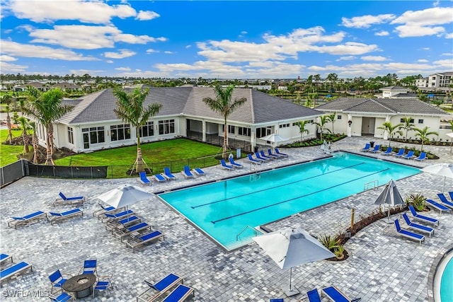 view of pool featuring a yard and a patio area