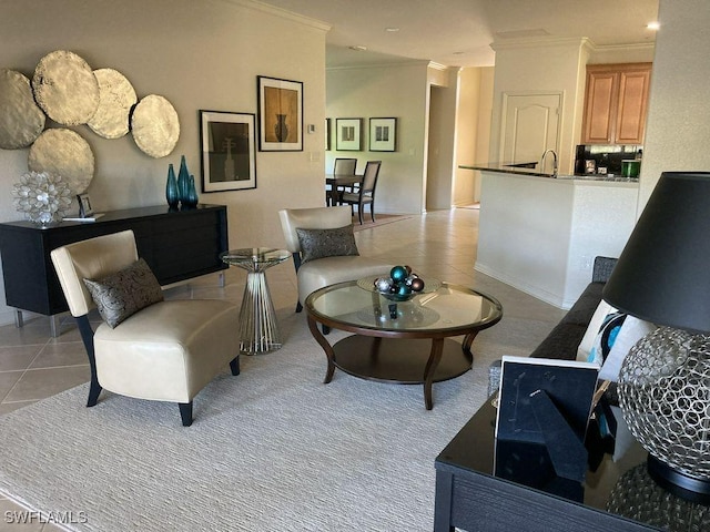 living room featuring sink, light tile patterned flooring, and ornamental molding