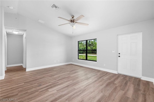 empty room with light hardwood / wood-style flooring, ceiling fan, and lofted ceiling