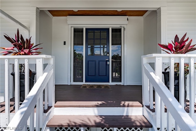 view of exterior entry with covered porch