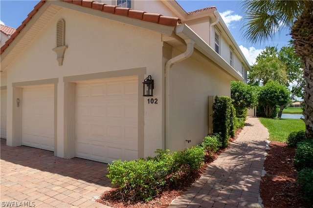 view of side of home with a garage