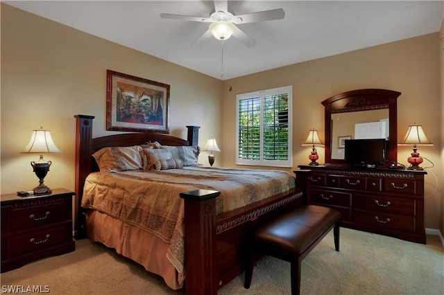 bedroom with ceiling fan and light colored carpet