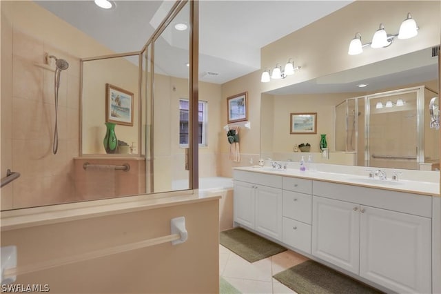 bathroom featuring a shower with shower door, tile flooring, and dual vanity