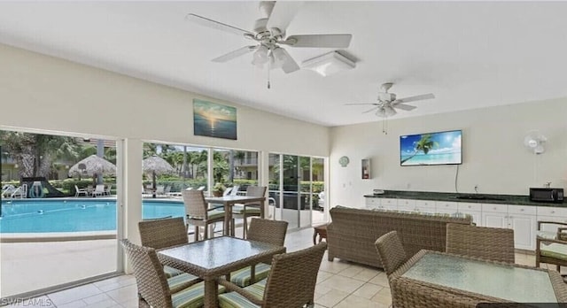 interior space with ceiling fan