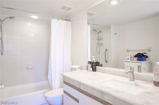 full bathroom with shower / bath combination with curtain, toilet, and vanity