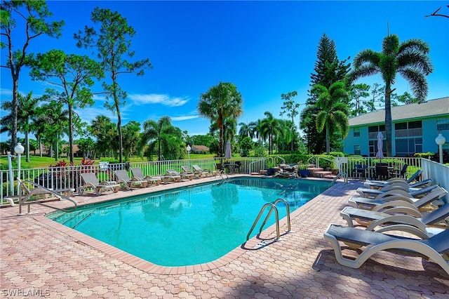 view of swimming pool featuring a patio