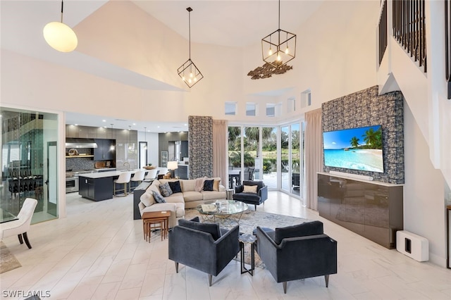 living room with a towering ceiling