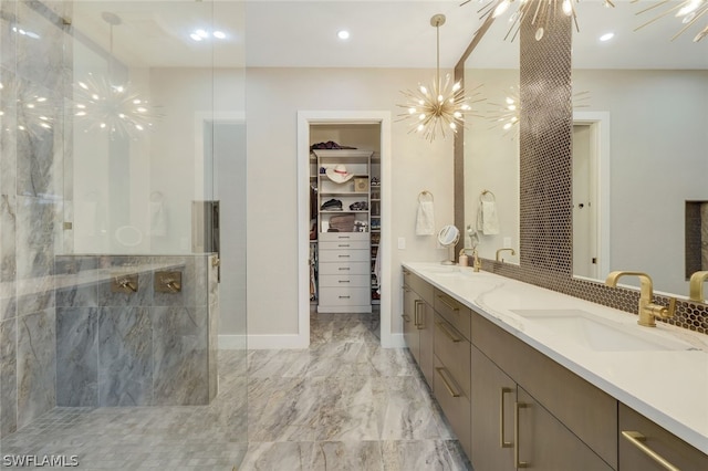 bathroom featuring vanity, a shower, and an inviting chandelier