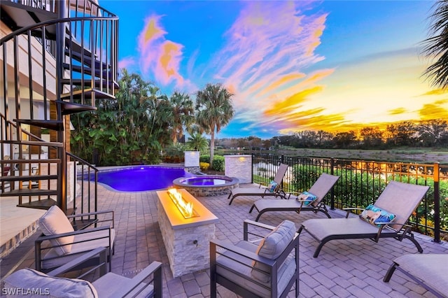 patio terrace at dusk with a fire pit