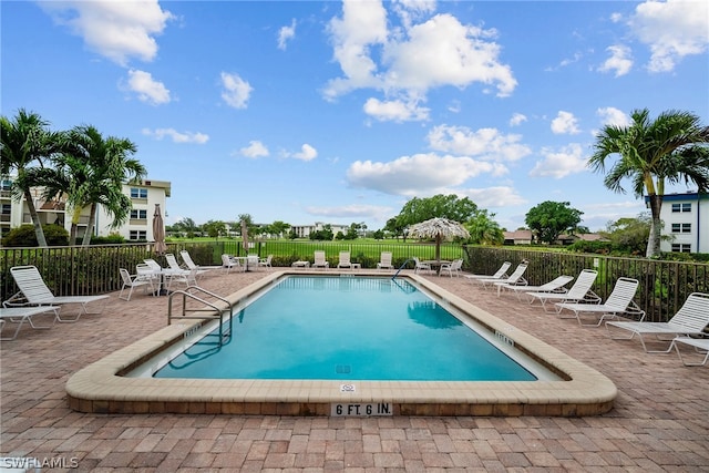 view of swimming pool featuring a patio area