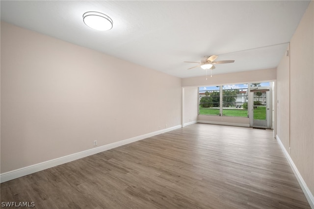 spare room featuring ceiling fan and hardwood / wood-style flooring