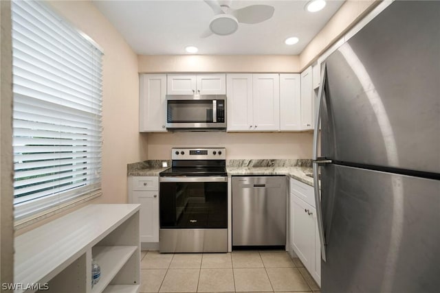 kitchen with white cabinetry, recessed lighting, appliances with stainless steel finishes, light tile patterned floors, and ceiling fan