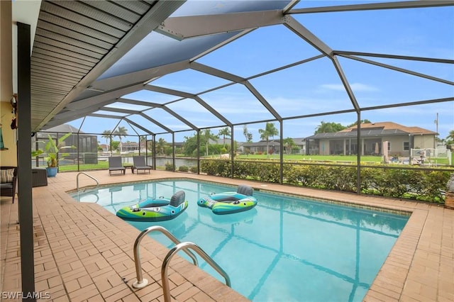 view of swimming pool with a lanai and a patio