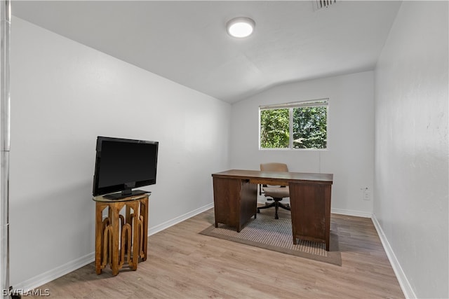 office area featuring lofted ceiling and light hardwood / wood-style floors