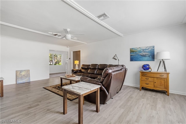 living room with light hardwood / wood-style flooring, ceiling fan, and crown molding