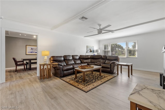 living room with ceiling fan, ornamental molding, and light hardwood / wood-style floors