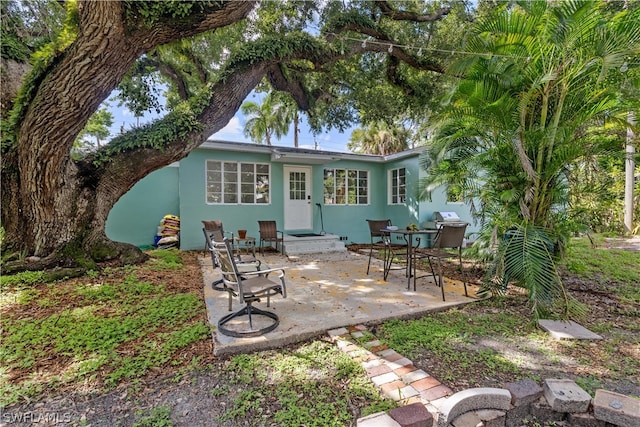 rear view of house featuring a patio area